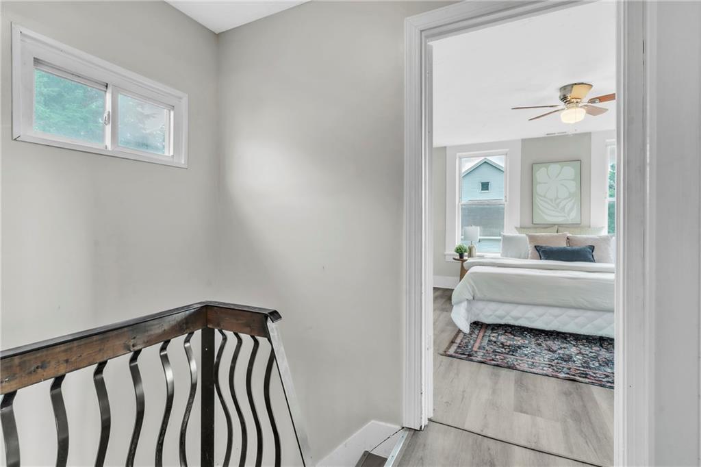 305 1/2 East Lutton Street New Castle, PA 16101 - Photo 16 of 39 a view of a hallway with furniture and staircase