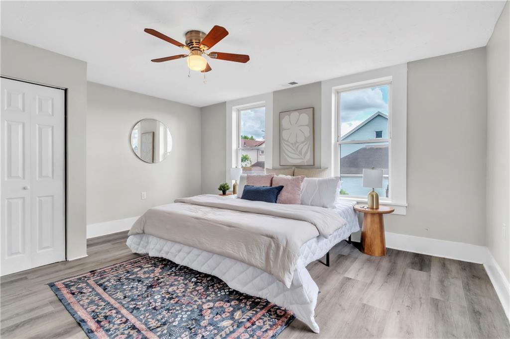 305 1/2 East Lutton Street New Castle, PA 16101 - Photo 17 of 39 a bedroom with a large bed and a chandelier