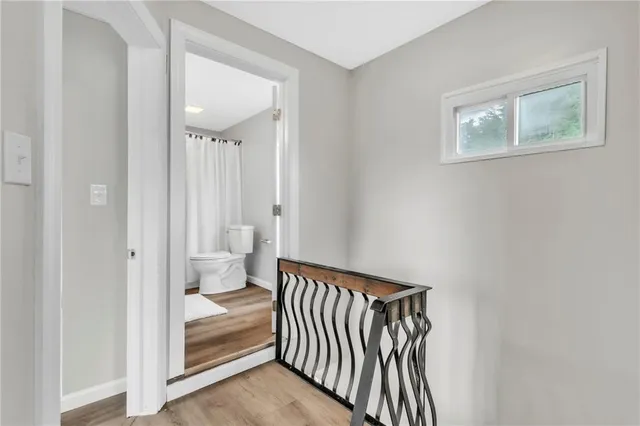 a view of a hallway with bathroom