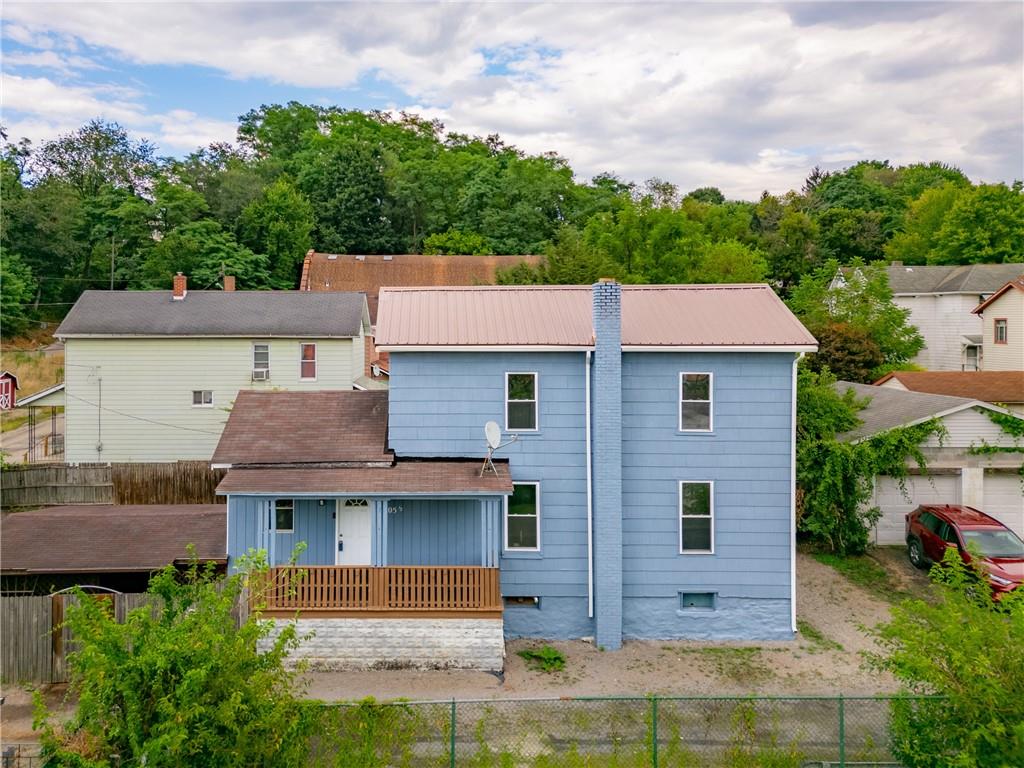 305 1/2 East Lutton Street New Castle, PA 16101 - Photo 2 of 39 an aerial view of a house with a yard
