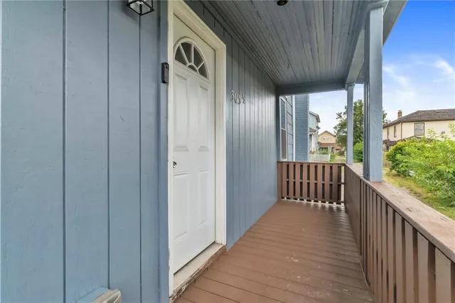 a view of a balcony with wooden floor