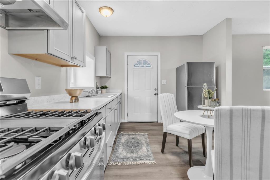 305 1/2 East Lutton Street New Castle, PA 16101 - Photo 7 of 39 a kitchen with stainless steel appliances granite countertop a stove a sink and a refrigerator