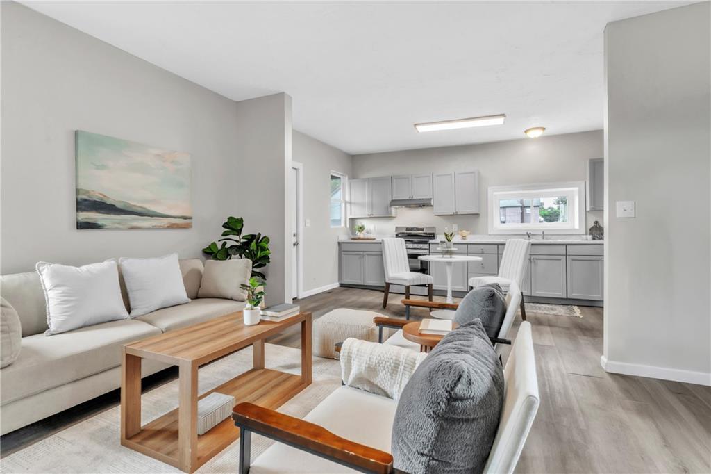 305 1/2 East Lutton Street New Castle, PA 16101 - Photo 8 of 39 a living room with furniture and a kitchen