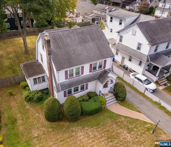 an aerial view of residential house with outdoor space and swimming pool