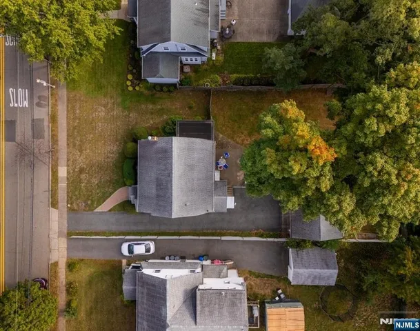 an aerial view of a house with lake view