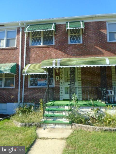 104 Wiltshire Road Baltimore, MD 21221 - Photo 1 of 13 front view of a house with a yard