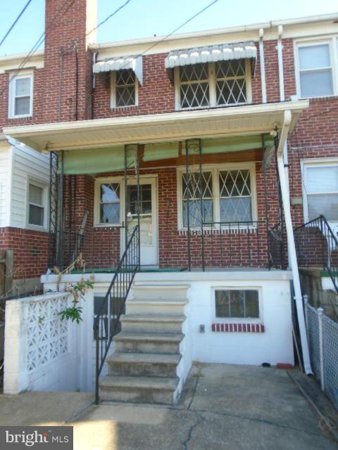 104 Wiltshire Road Baltimore, MD 21221 - Photo 3 of 13 a front view of a building with outdoor area