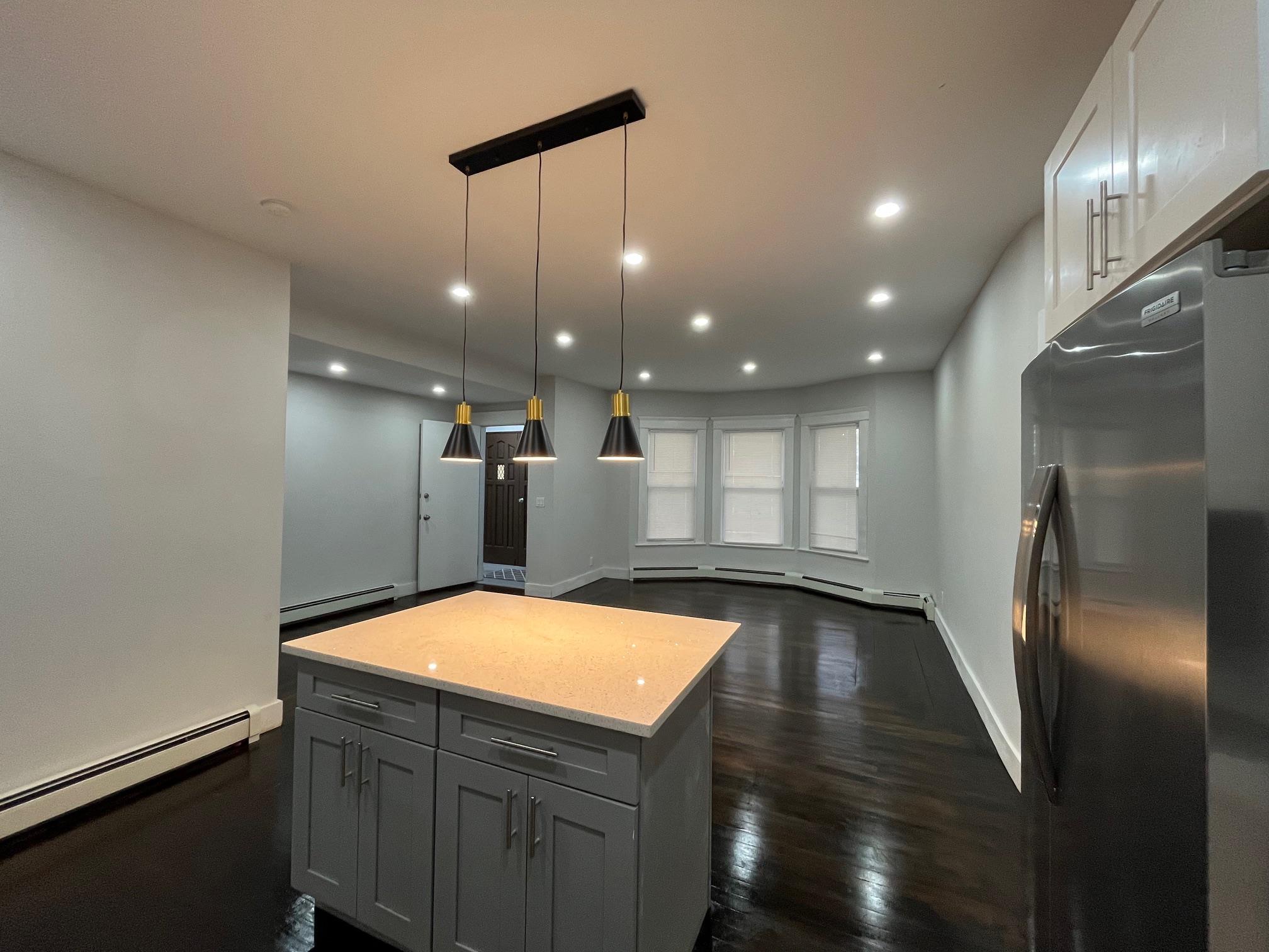 a kitchen with stainless steel appliances a refrigerator and a sink