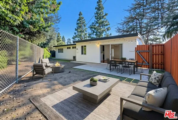 a view of a backyard with a patio