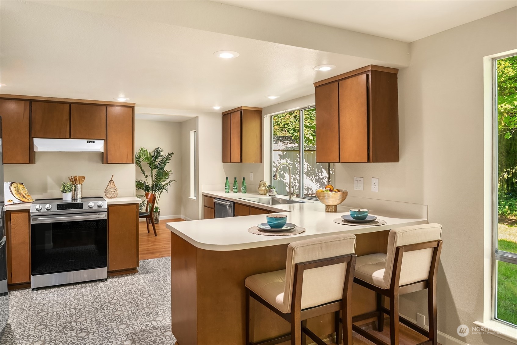 16617 24th Drive Southeast Bothell, WA 98012 - Photo 11 of 29 a kitchen with stainless steel appliances kitchen island granite countertop a sink and cabinets