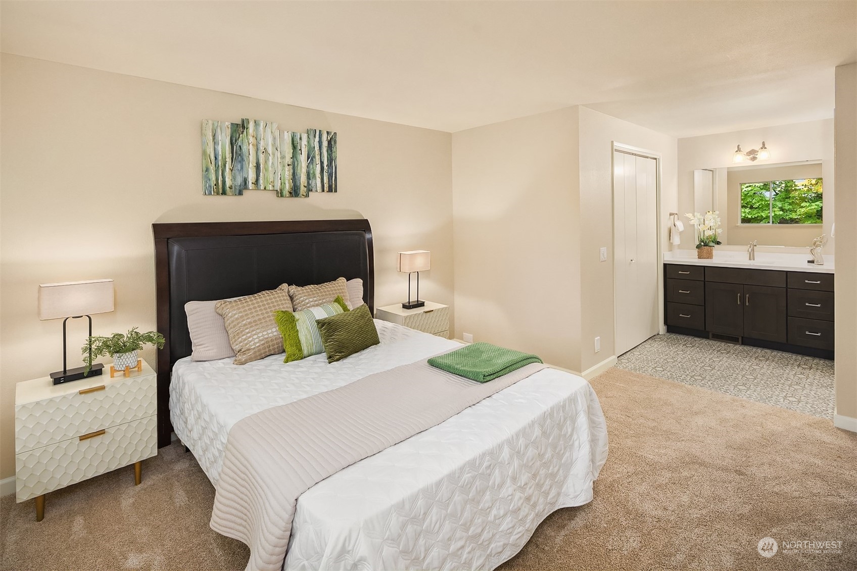 16617 24th Drive Southeast Bothell, WA 98012 - Photo 19 of 29 a large bed sitting in a bedroom and a table