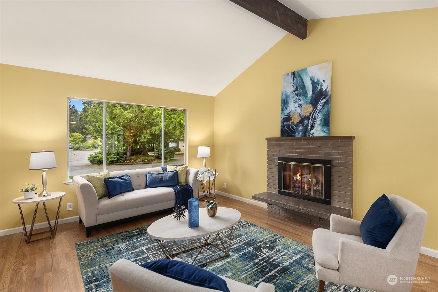 16617 24th Drive Southeast Bothell, WA 98012 - Photo 3 of 29 a living room with furniture and a fireplace