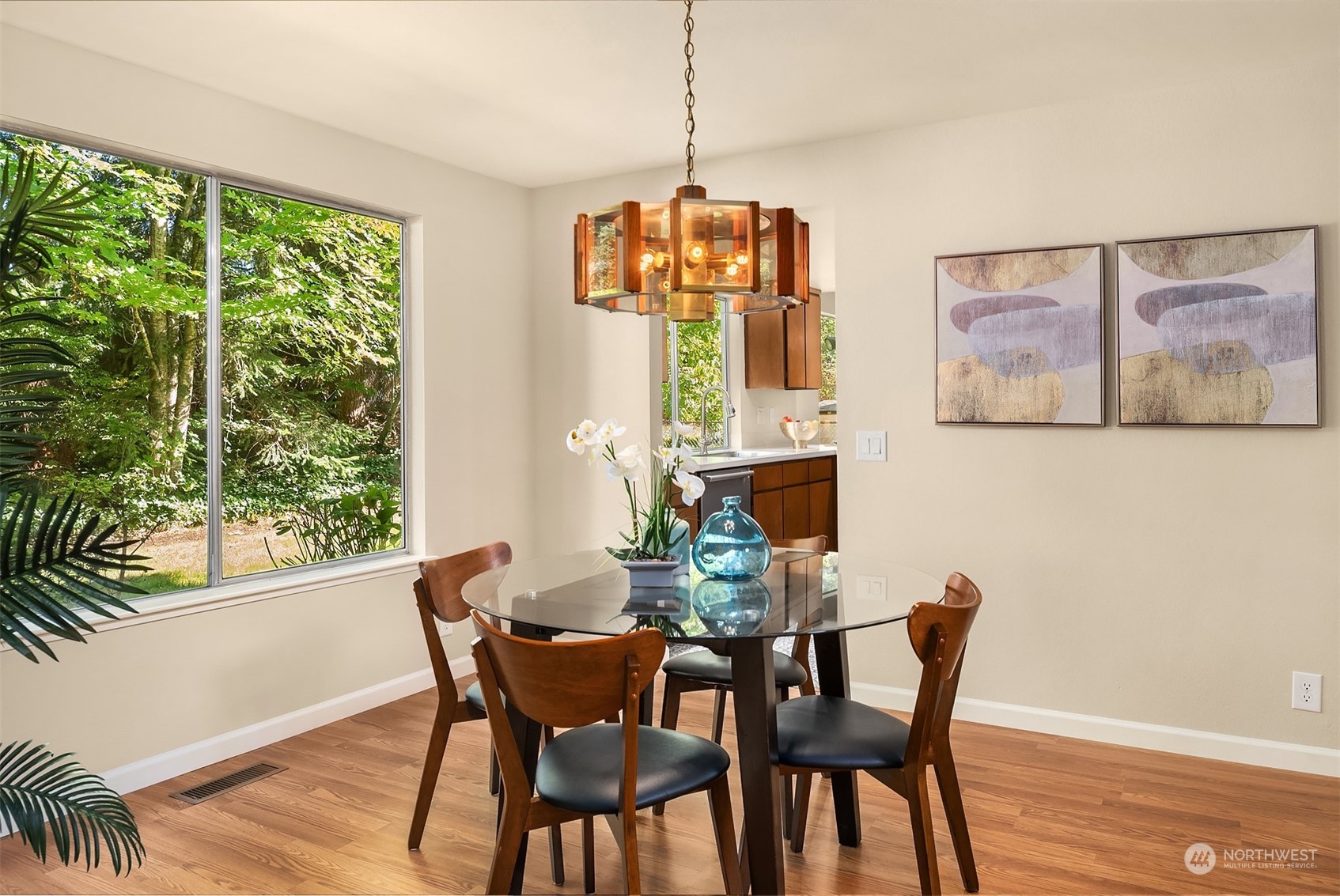 16617 24th Drive Southeast Bothell, WA 98012 - Photo 6 of 29 a dining room with furniture a window and a chandelier
