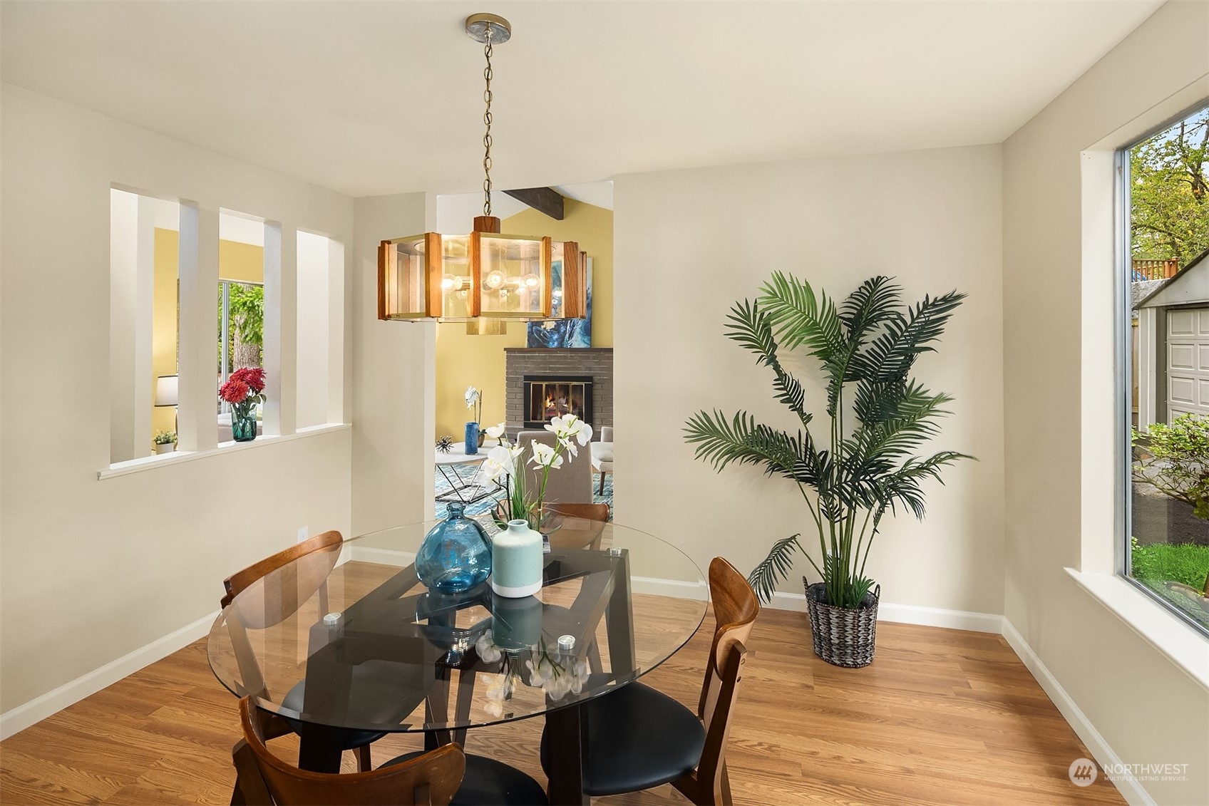 16617 24th Drive Southeast Bothell, WA 98012 - Photo 7 of 29 a dining room with furniture potted plants and wooden floor