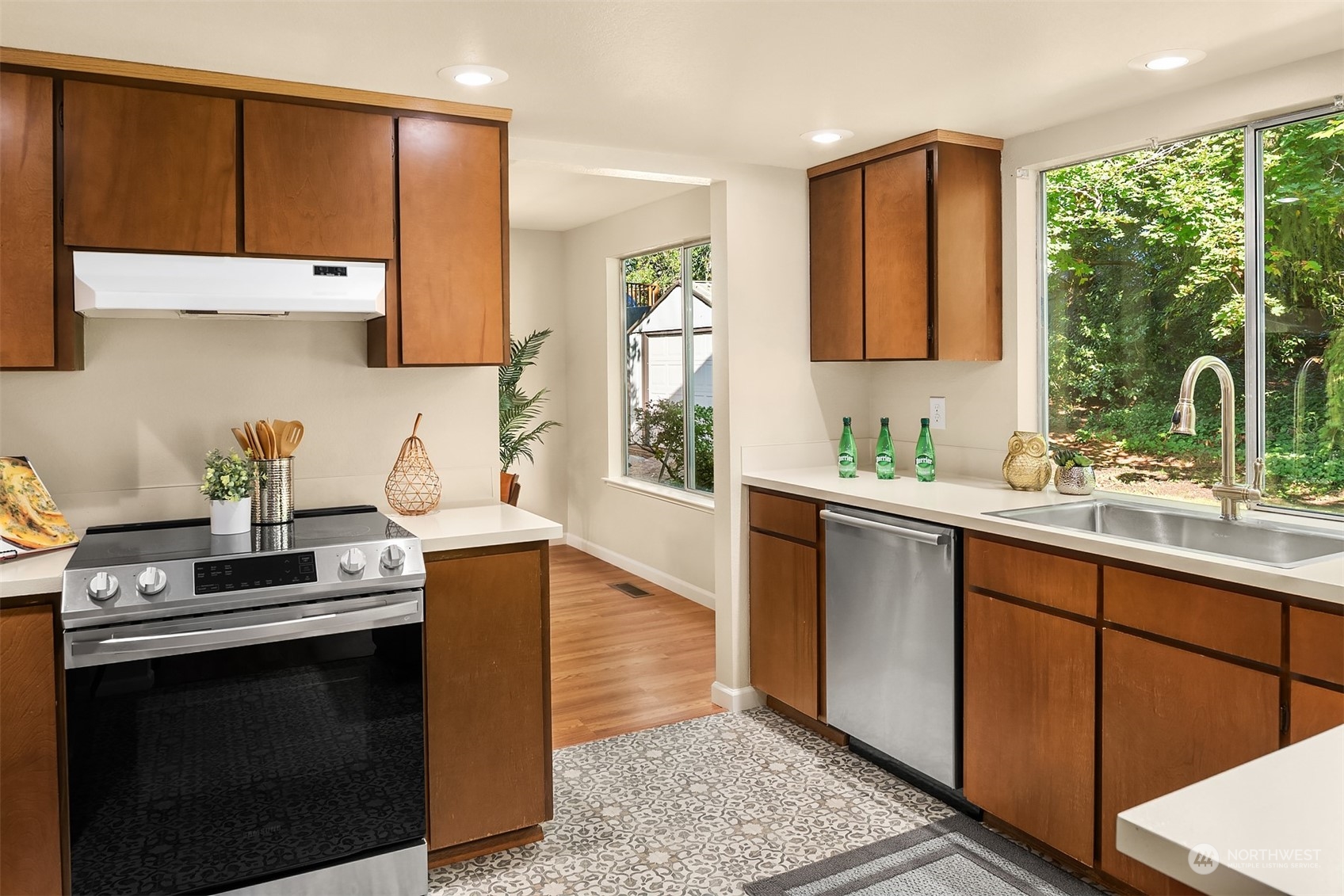 16617 24th Drive Southeast Bothell, WA 98012 - Photo 8 of 29 a kitchen with stainless steel appliances granite countertop a sink stove and cabinets