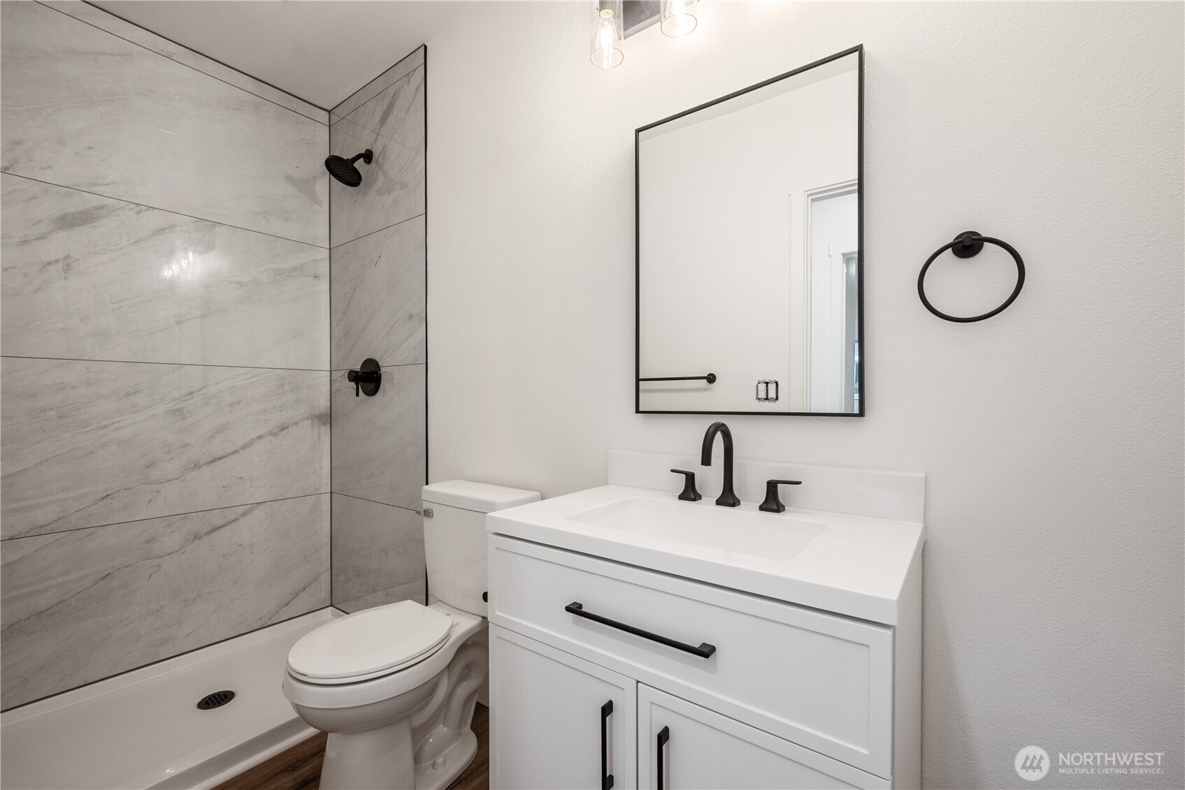 450 16th Avenue Longview, WA 98632 - Photo 12 of 23 a bathroom with a sink toilet and shower