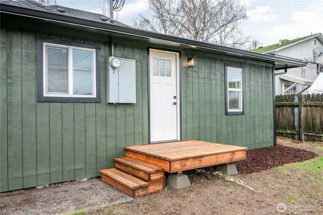 a backyard of a house with seating space