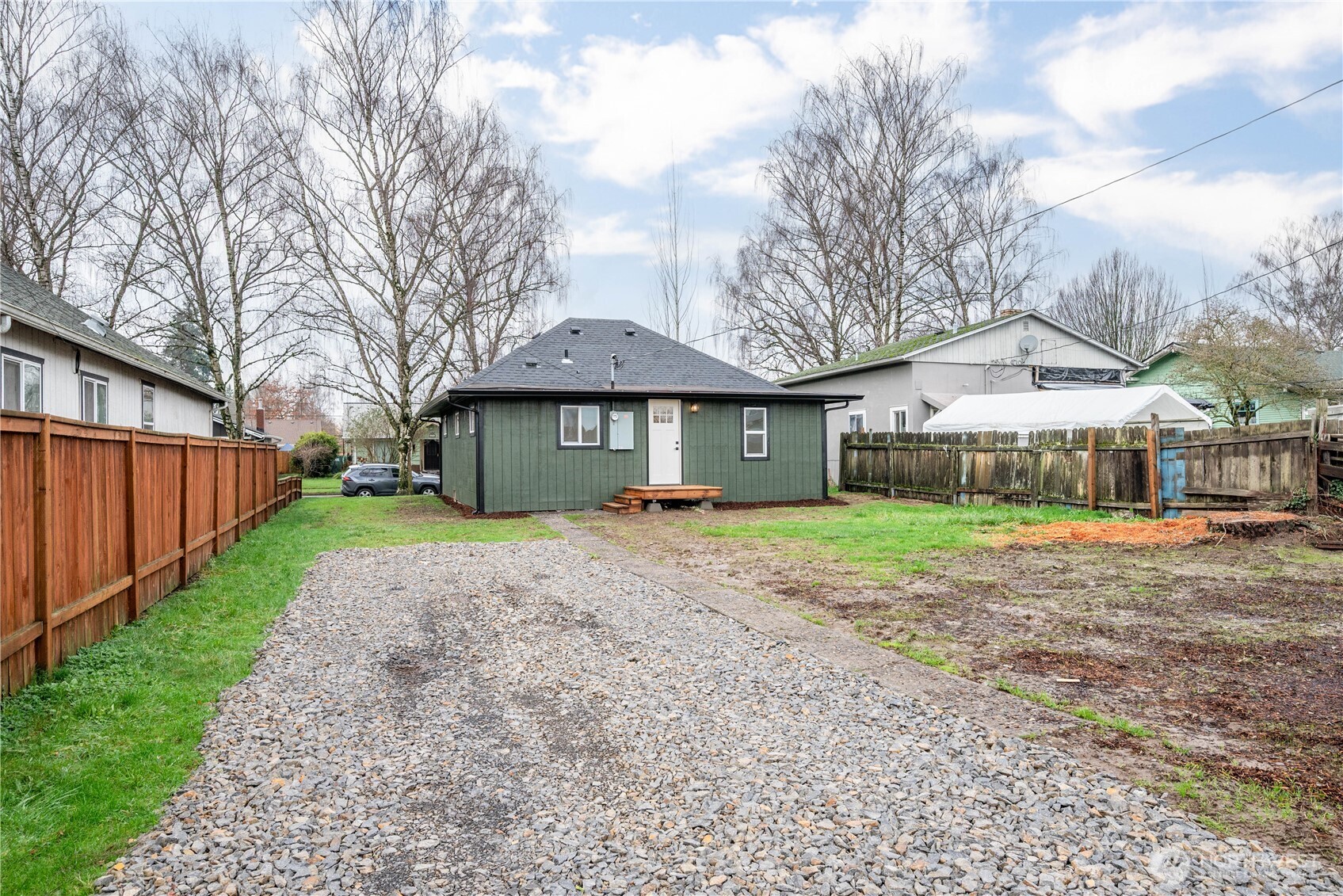 450 16th Avenue Longview, WA 98632 - Photo 20 of 23 a front view of a house with a yard and large tree