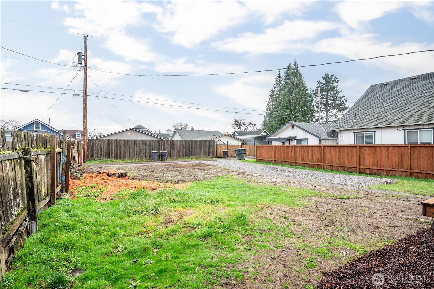 450 16th Avenue Longview, WA 98632 - Photo 22 of 23 a view of a garden with a car park in front of it