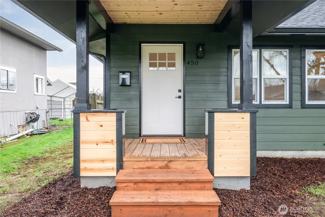 a front view of a house with a garden