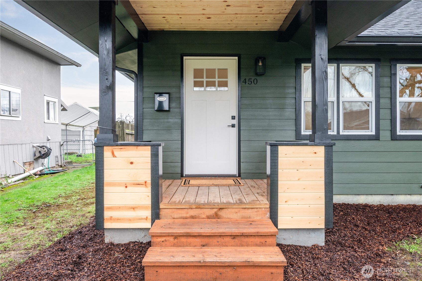 450 16th Avenue Longview, WA 98632 - Photo 3 of 23 a front view of a house with a garden