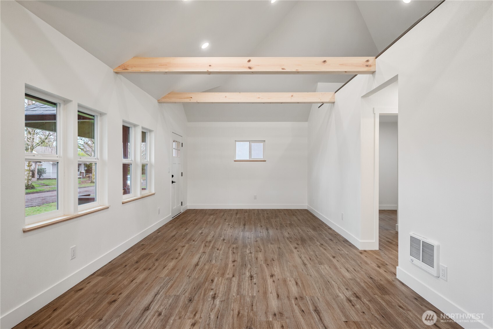 450 16th Avenue Longview, WA 98632 - Photo 5 of 23 a view of an empty room with wooden floor and a window
