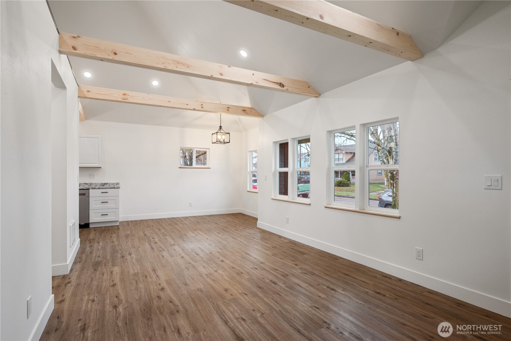 450 16th Avenue Longview, WA 98632 - Photo 6 of 23 a view of an empty room with wooden floor and a window