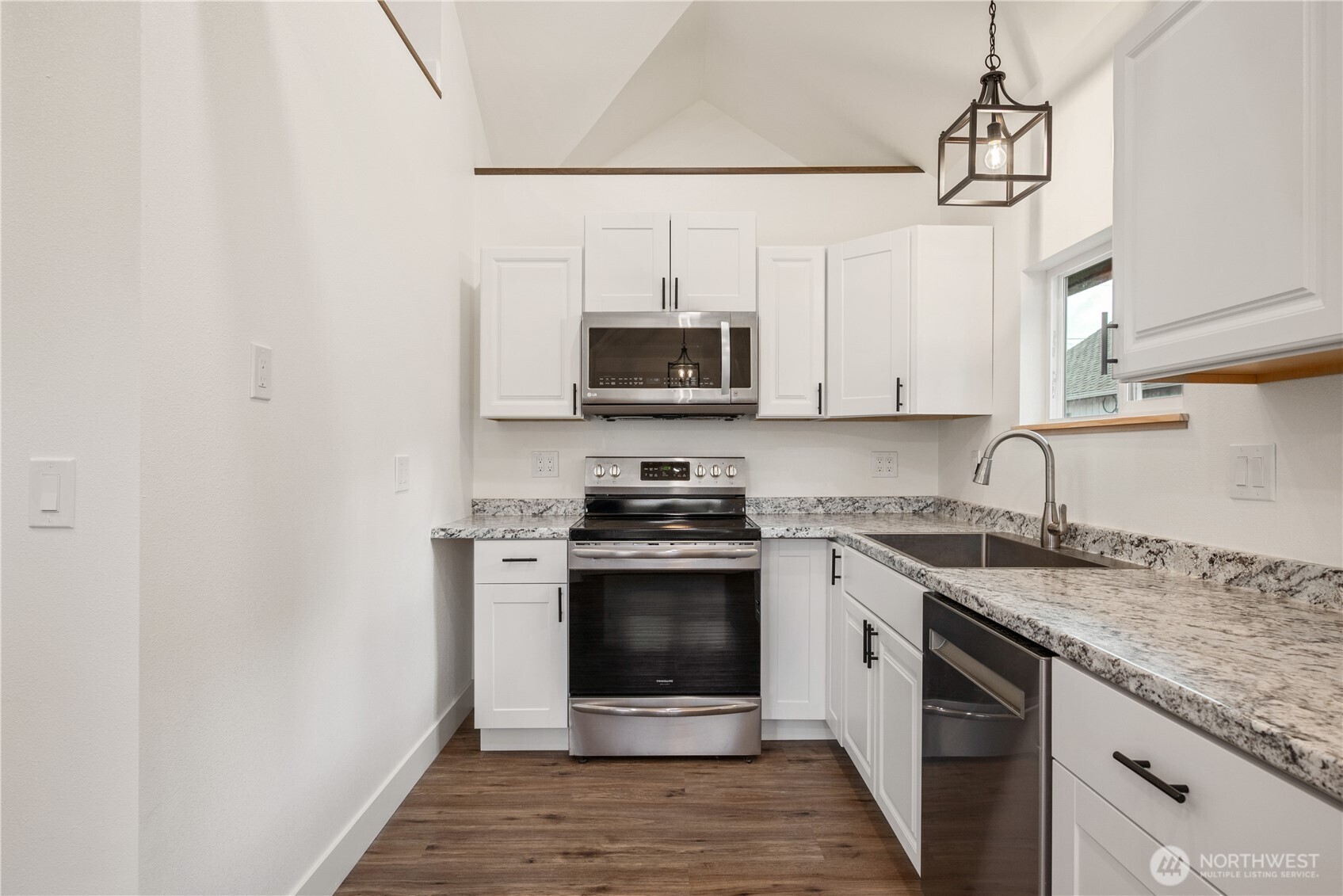 450 16th Avenue Longview, WA 98632 - Photo 9 of 23 a kitchen with stainless steel appliances granite countertop a stove a sink and a microwave