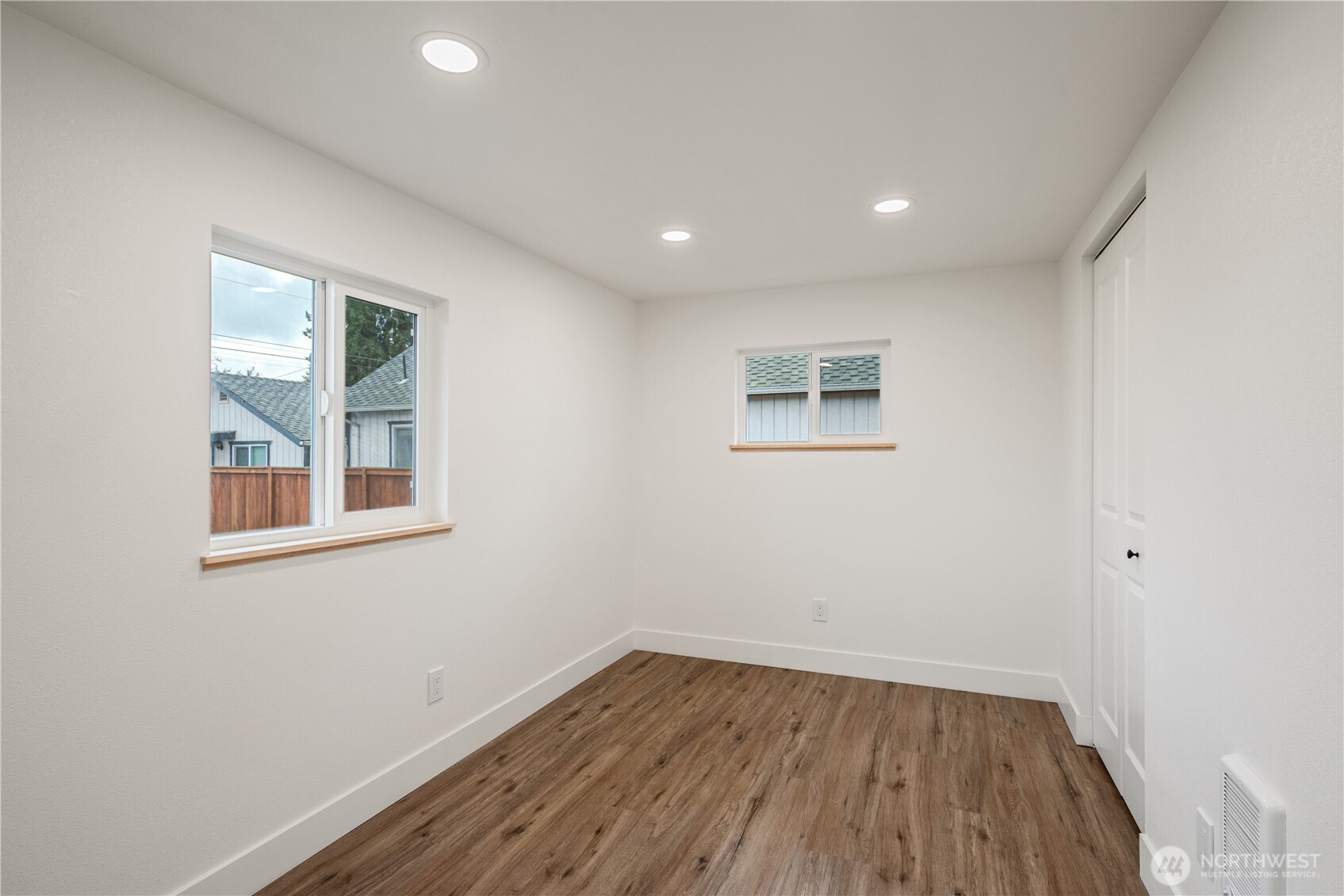 450 16th Avenue Longview, WA 98632 - Photo 10 of 23 an empty room with wooden floor and windows