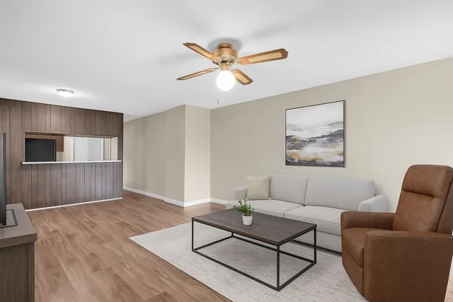 a living room with furniture and a window