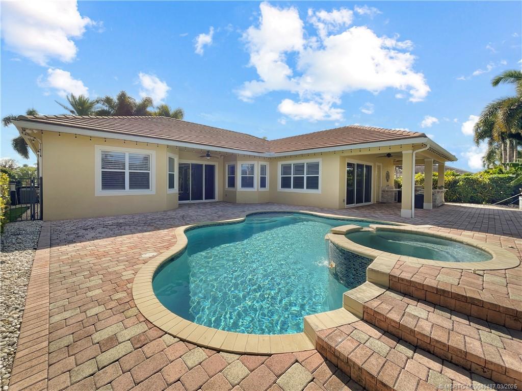 443 Southwest Lost River Road Stuart, FL 34997 - Photo 10 of 34 Back of home across the pool