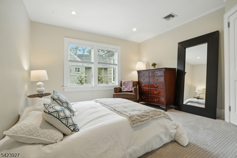 127 Green Village Road Madison, NJ 07940 - Photo 11 of 16 a bedroom with a bed and wooden floor