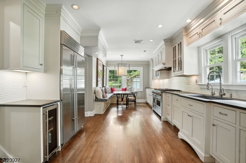 127 Green Village Road Madison, NJ 07940 - Photo 2 of 16 a kitchen with sink cabinets and wooden floor