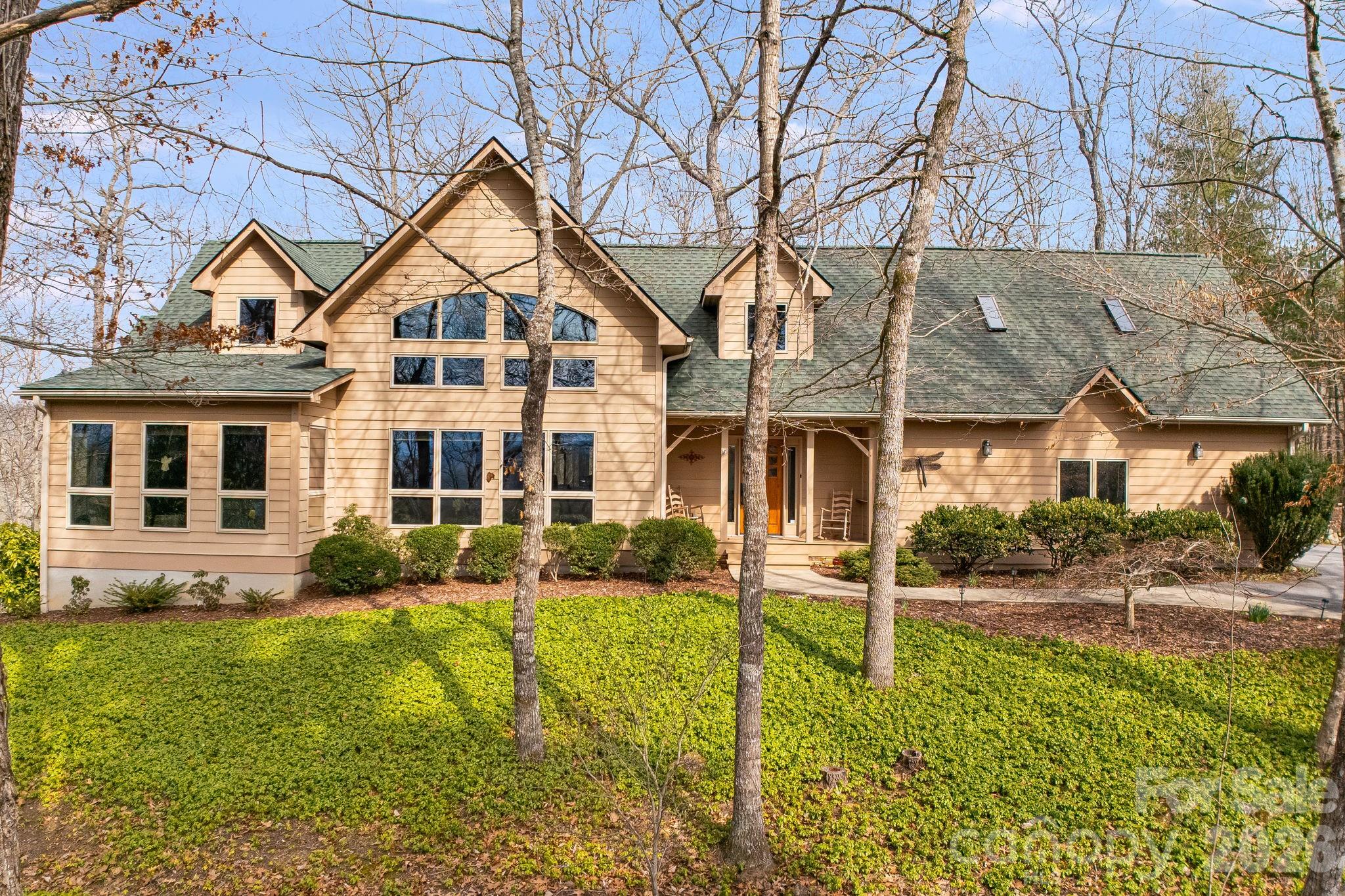 5584 Spring Road Hendersonville, NC 28739 - Photo 1 of 45 front view of a house with a yard
