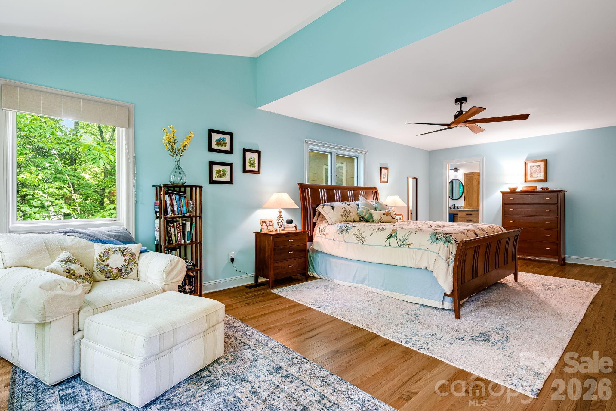 5584 Spring Road Hendersonville, NC 28739 - Photo 23 of 45 a bed room with a bed and a couch