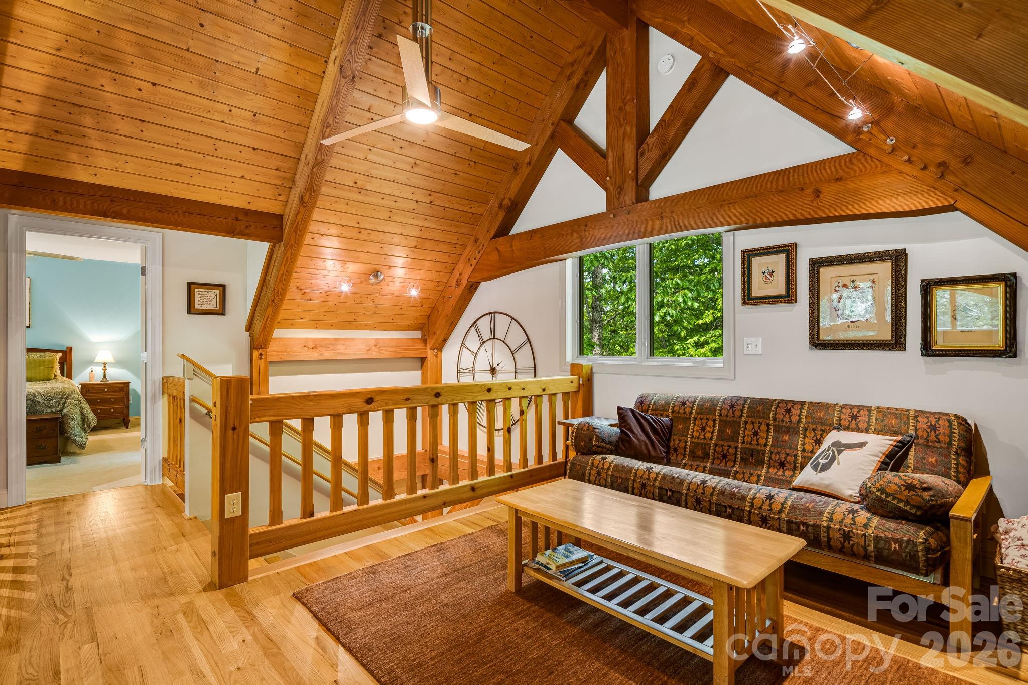 5584 Spring Road Hendersonville, NC 28739 - Photo 26 of 45 a bedroom with furniture and a large window