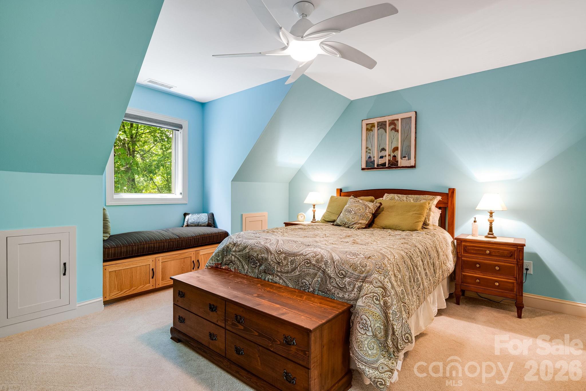 5584 Spring Road Hendersonville, NC 28739 - Photo 27 of 45 a bedroom with a bed and a window