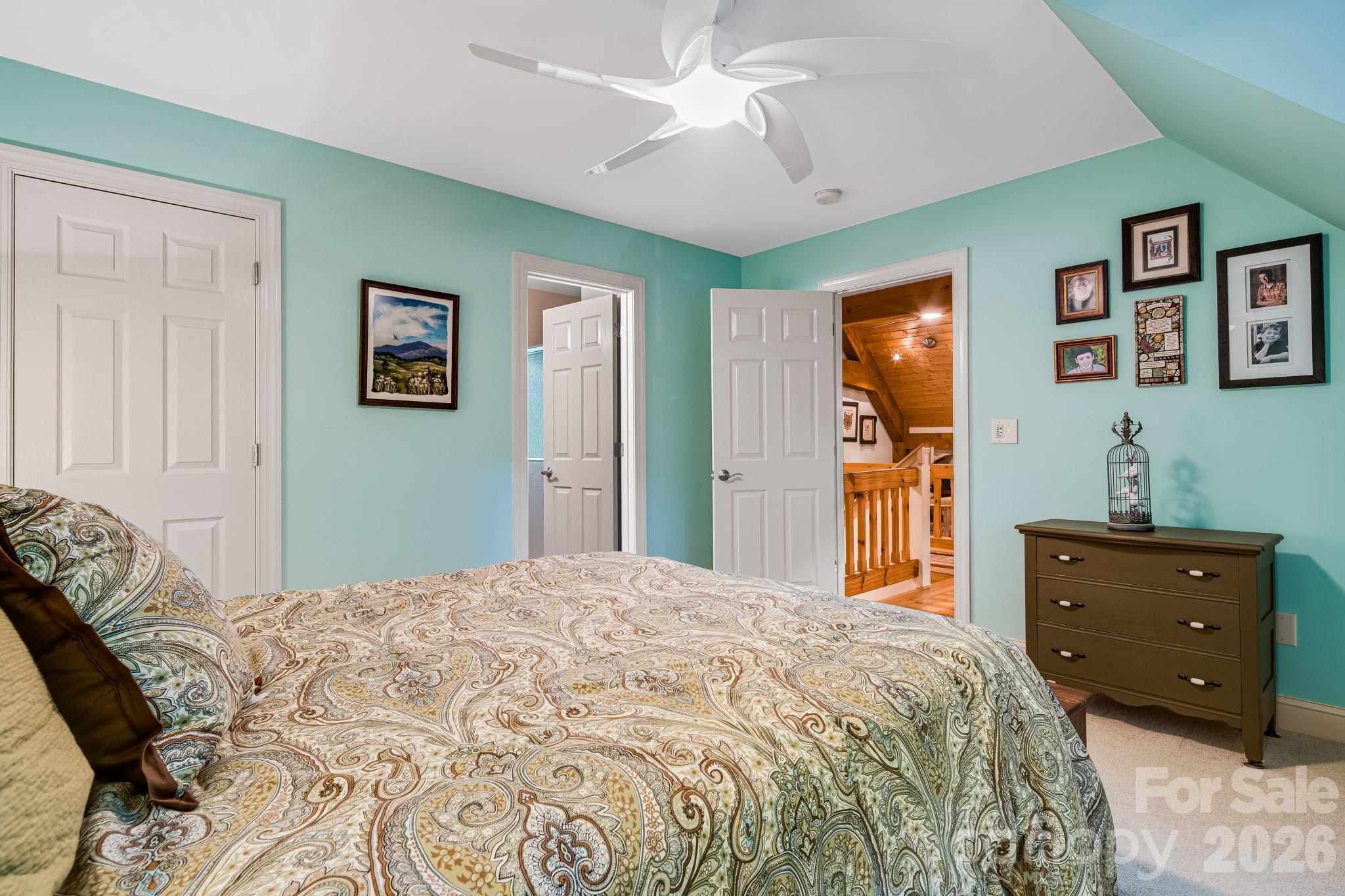 5584 Spring Road Hendersonville, NC 28739 - Photo 28 of 45 a bedroom with a bed and a dresser