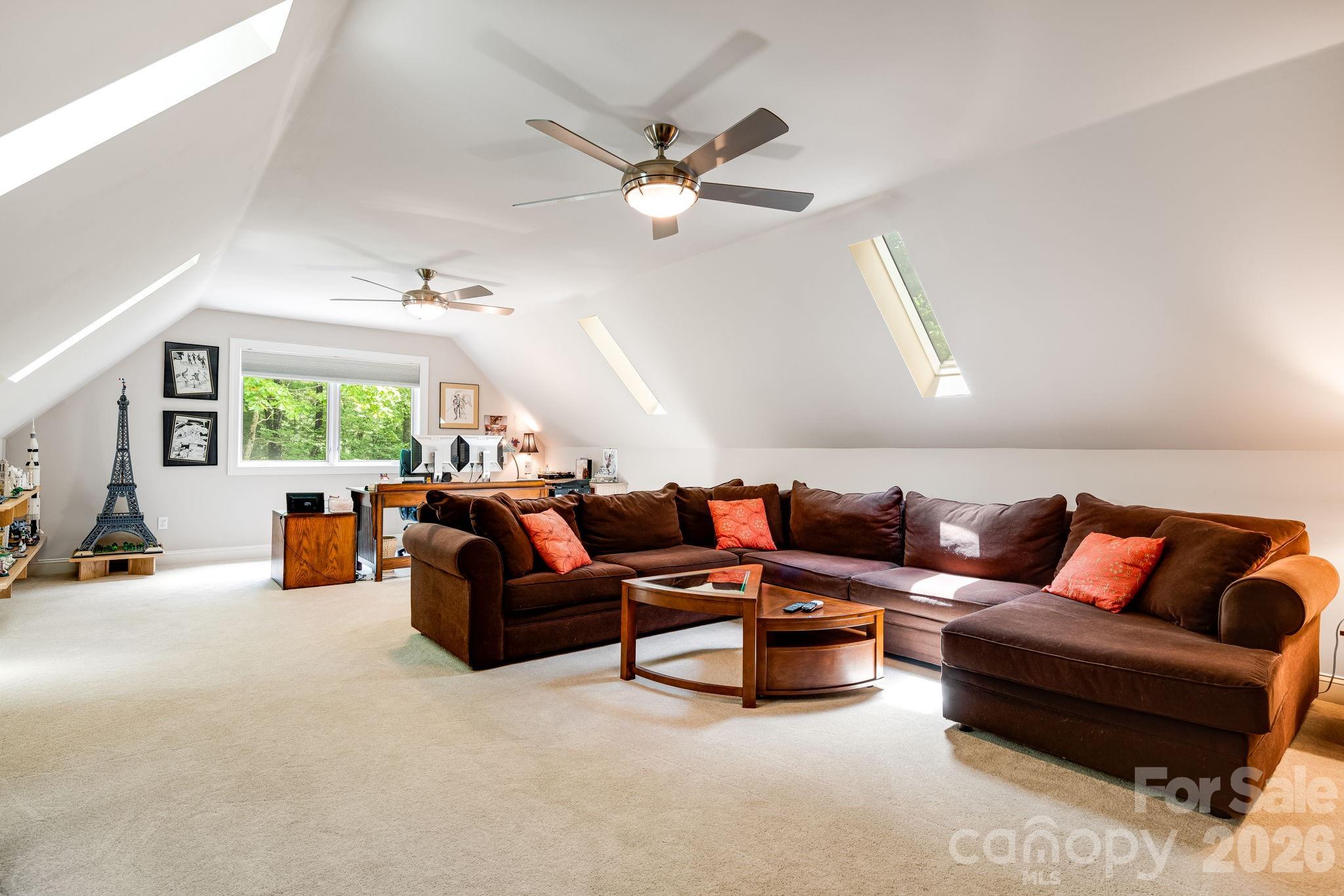 5584 Spring Road Hendersonville, NC 28739 - Photo 32 of 45 a living room with furniture and a large window