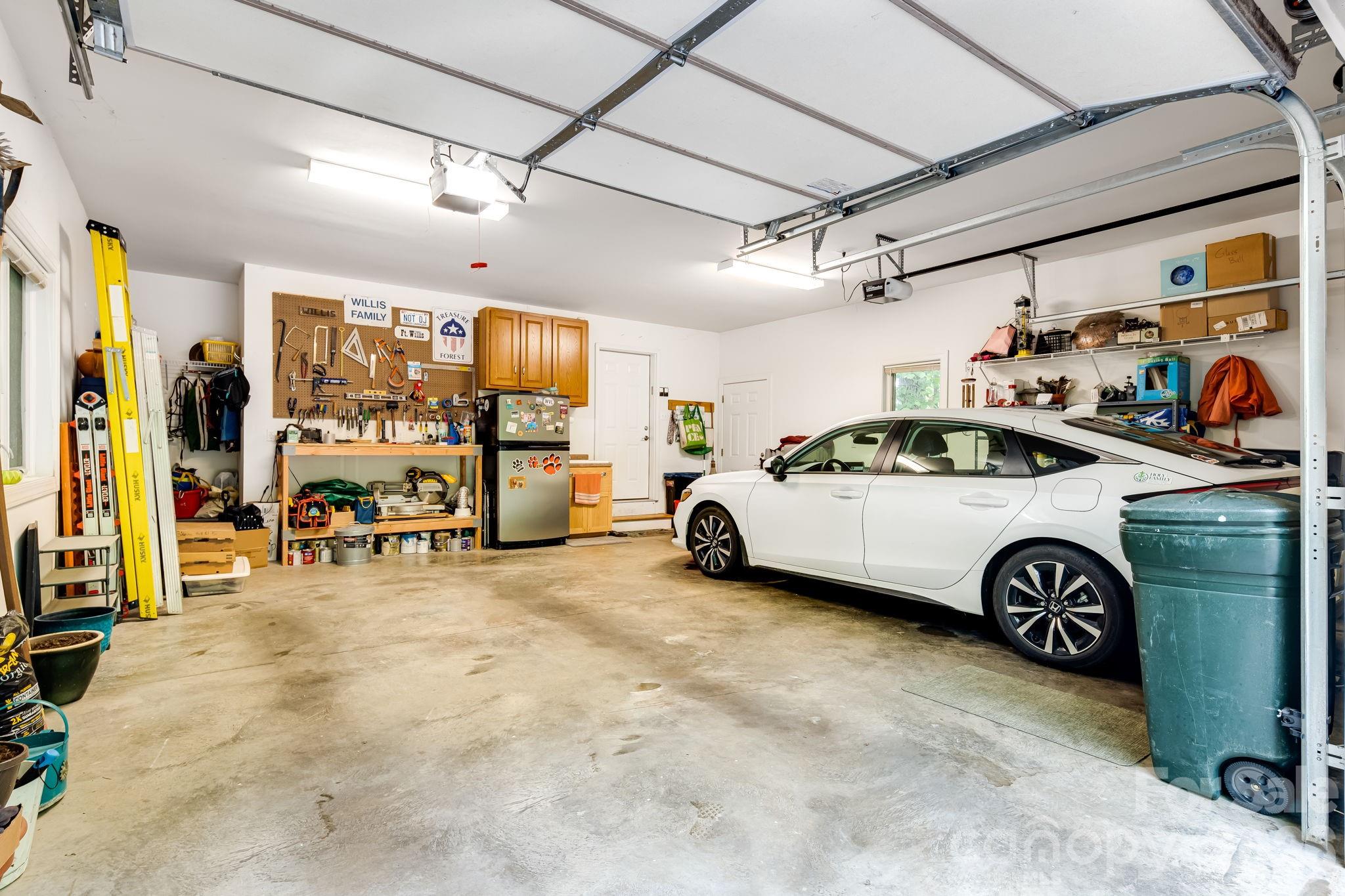 5584 Spring Road Hendersonville, NC 28739 - Photo 39 of 45 a view of parking garage with cars