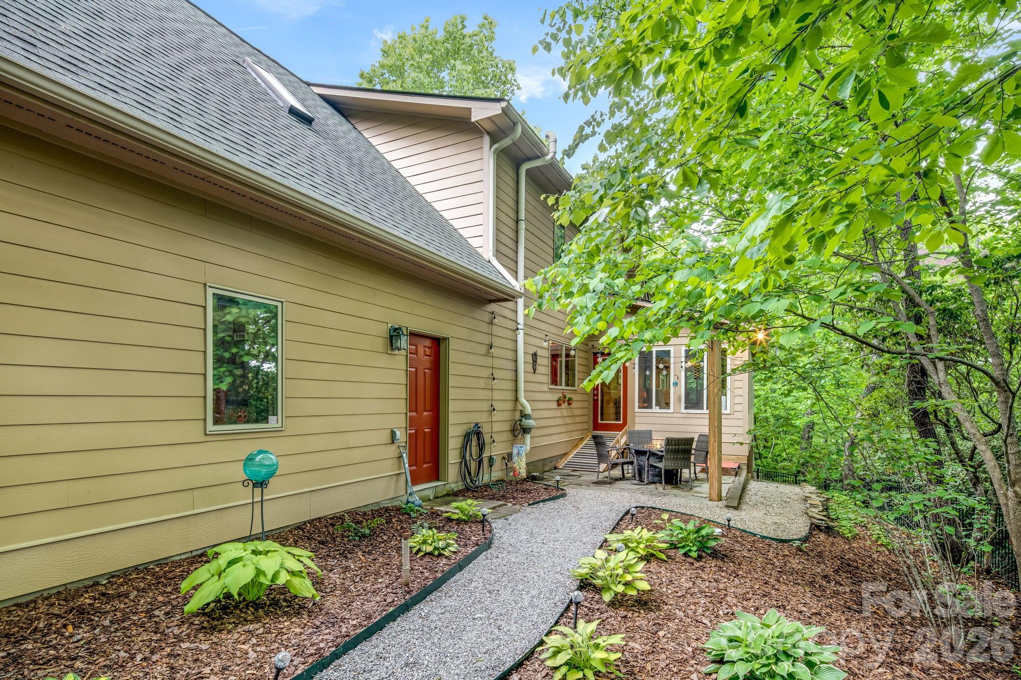 5584 Spring Road Hendersonville, NC 28739 - Photo 40 of 45 a view of a backyard with sitting area