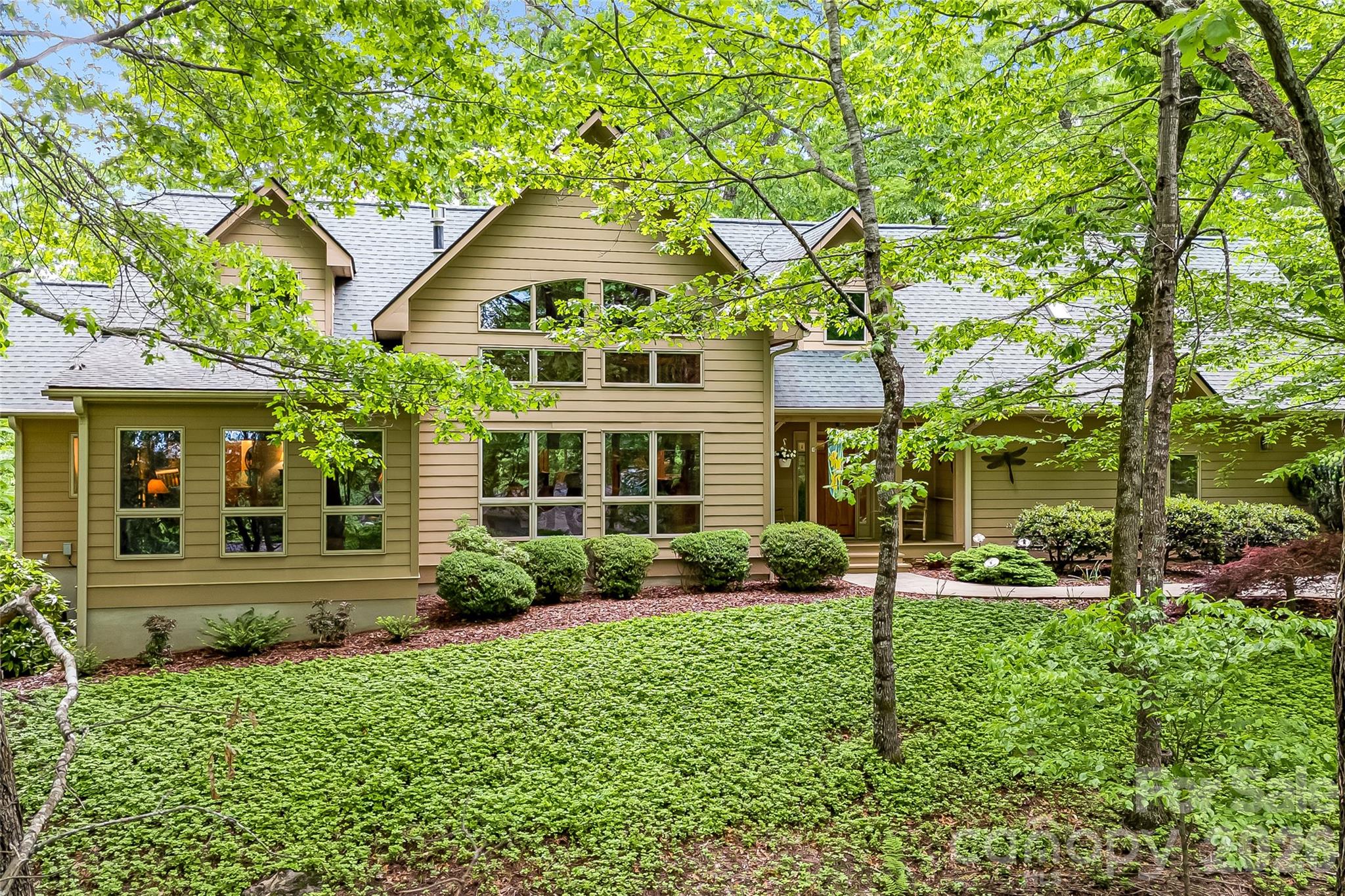 5584 Spring Road Hendersonville, NC 28739 - Photo 4 of 45 front view of a house with a yard