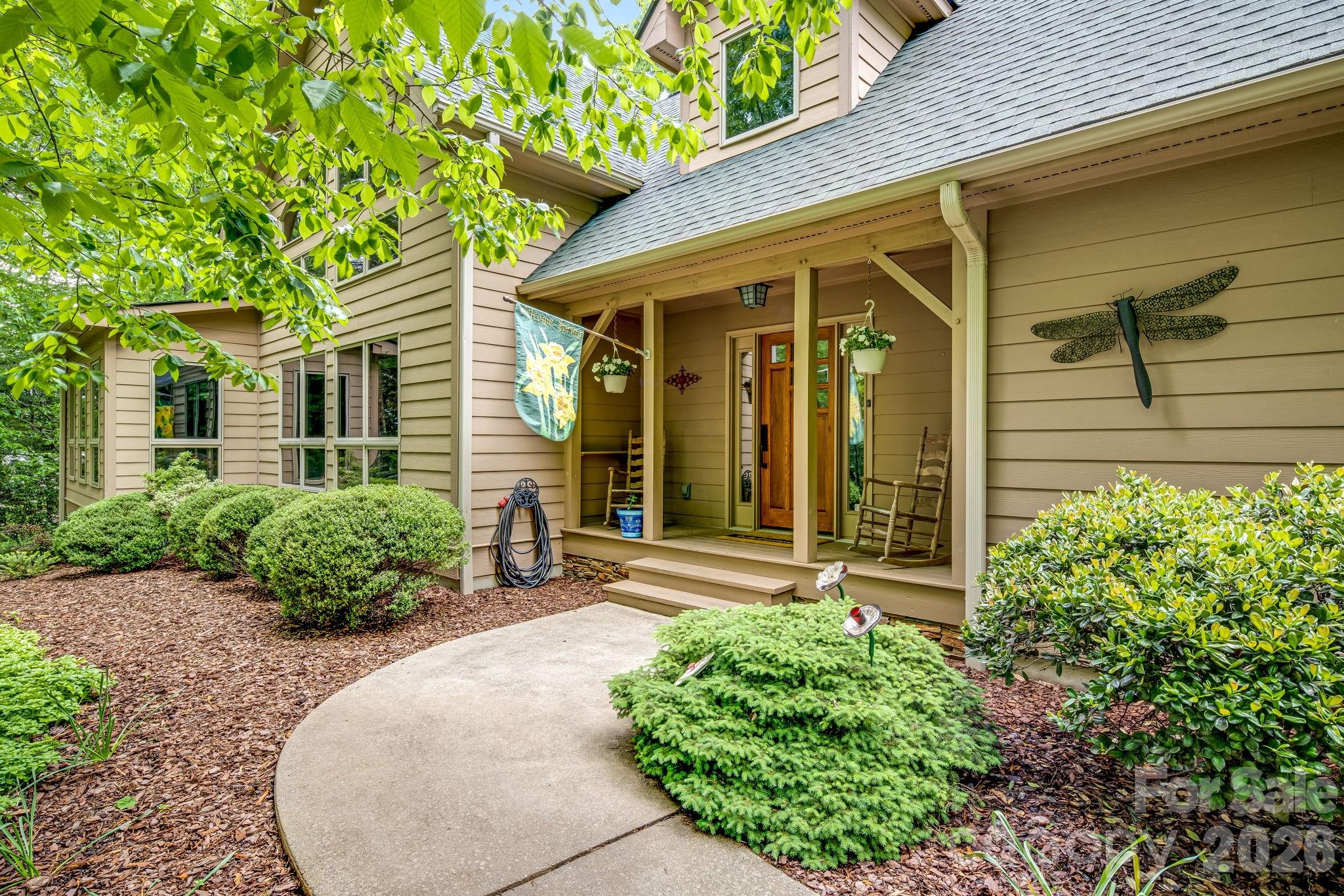 5584 Spring Road Hendersonville, NC 28739 - Photo 5 of 45 front view of a house with potted plants