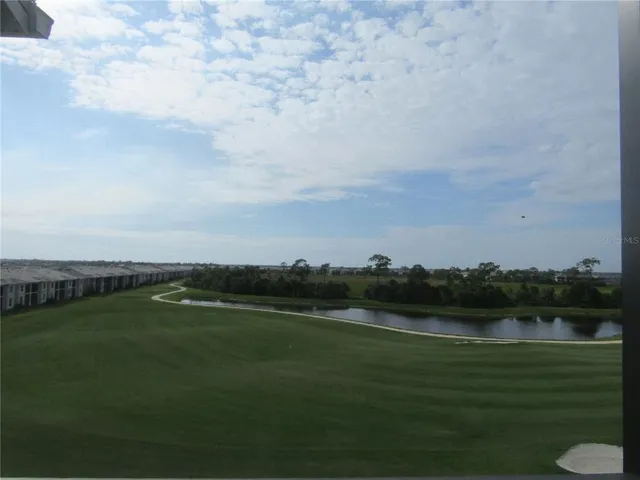 a view of a lake with houses in background