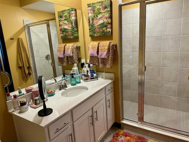 a bathroom with a sink double vanity and a mirror