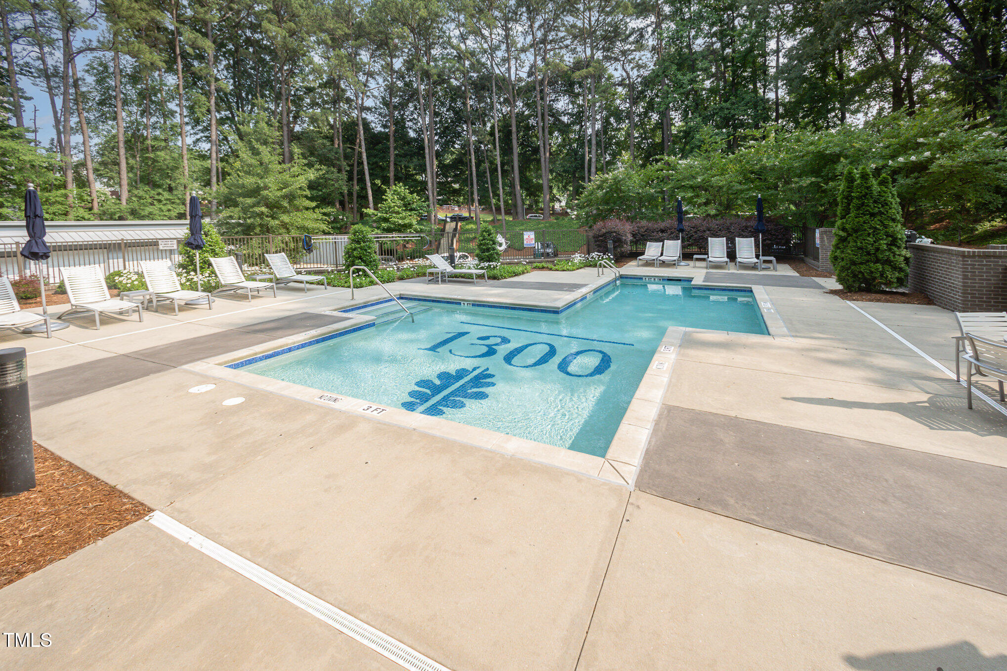 1300 St Marys Street, Unit 408 Raleigh, NC 27605 - Photo 24 of 28 a view of a swimming pool with a patio