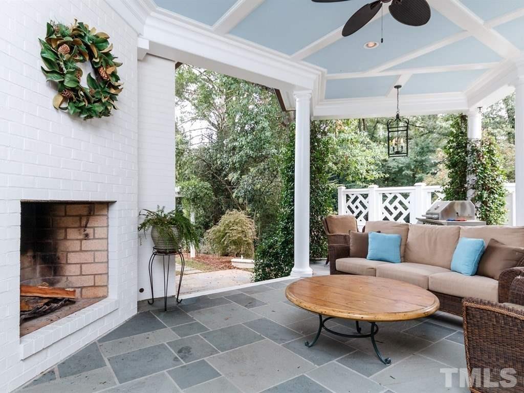 2305 Beechridge Road Raleigh, NC 27608 - Photo 13 of 24 a outdoor living space with furniture and a fireplace