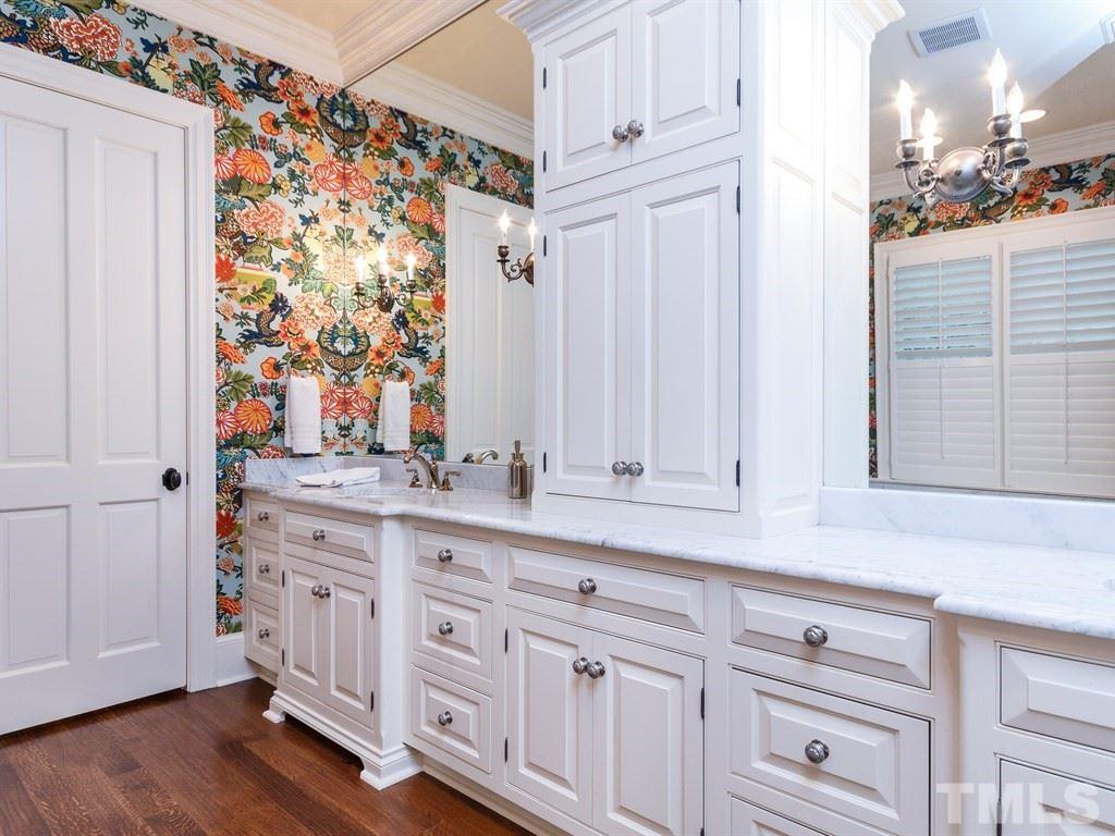 2305 Beechridge Road Raleigh, NC 27608 - Photo 16 of 24 a bathroom with a sink and a mirror