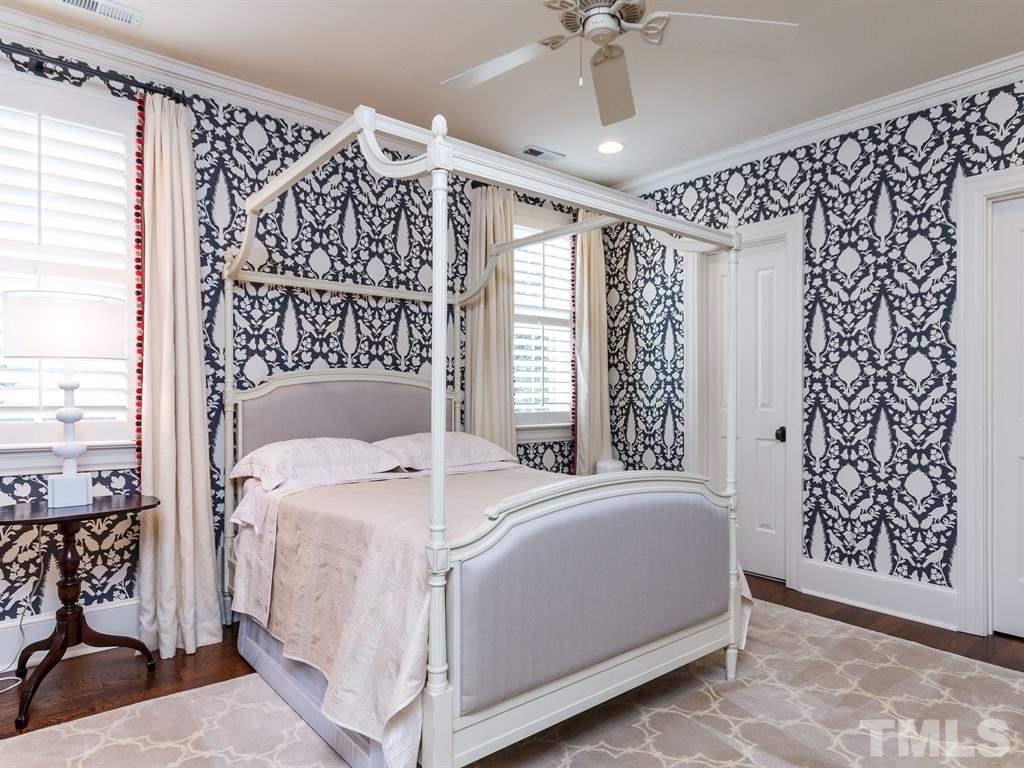 2305 Beechridge Road Raleigh, NC 27608 - Photo 17 of 24 a bedroom with a bed and a window