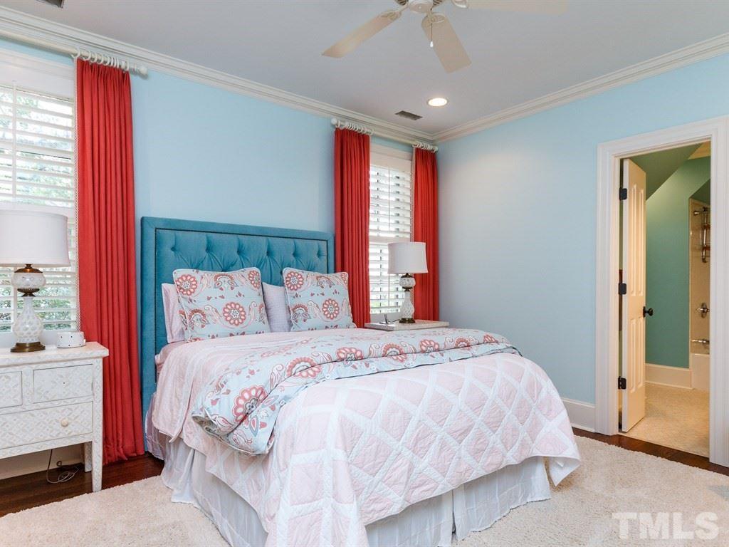 2305 Beechridge Road Raleigh, NC 27608 - Photo 18 of 24 a bedroom with a large bed and a window